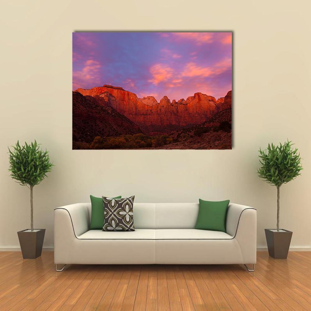 Red Rock Canyon at Sunset Canvas Wall Art in orange, purple and pink, single panel hung on a wall