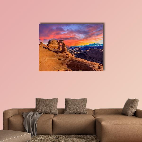 Sunset Over Delicate Arch, Arches National Park Canvas Wall Art in brown, orange and purple, single panel hung on a wall