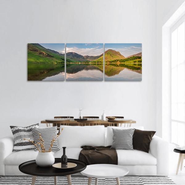 Sunset Over Calm Lake in England Panoramic Canvas Wall Art in brown, green and blue, hung on a wall