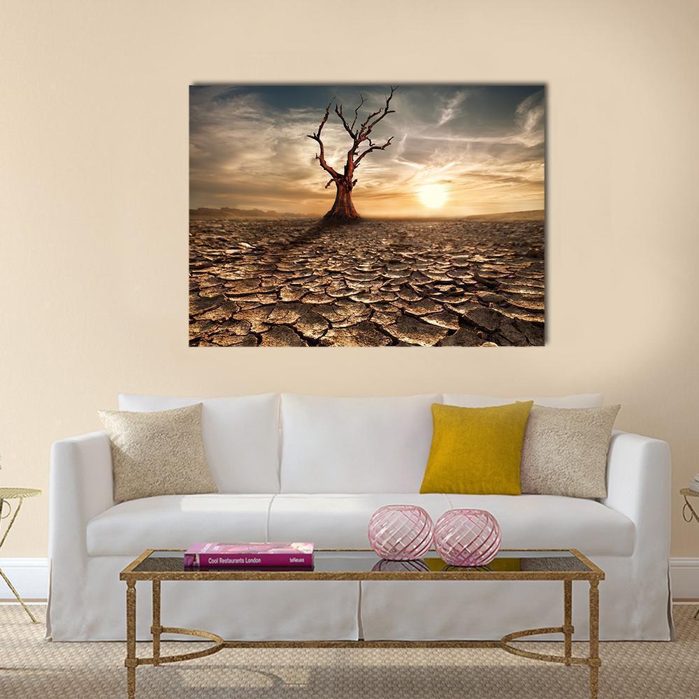 Sunset Over Drought-cracked Desert Canvas Wall Art in brown, orange and yellow, single panel hung on a wall