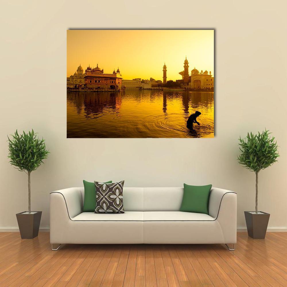Sunset at Golden Temple in India Canvas Wall Art in gold, orange and yellow, single panel hung on a wall