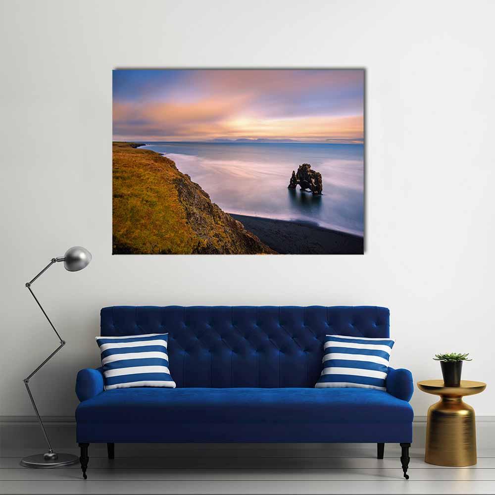 Hvitserkur Sea Stack at Sunset Canvas Wall Art in brown, orange and blue, single panel hung on a wall
