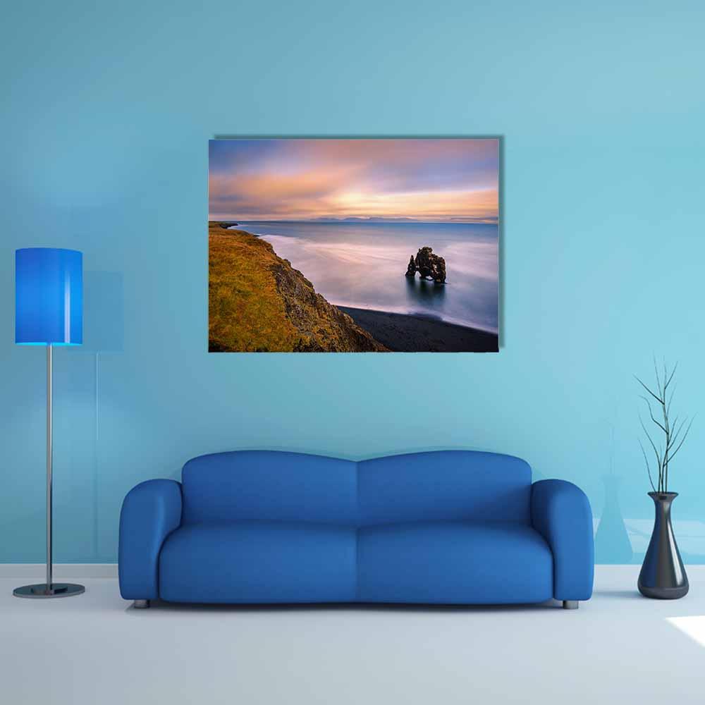 Hvitserkur Basalt Sea Stack at Sunset Canvas Wall Art in orange, blue and purple, single panel hung on a wall