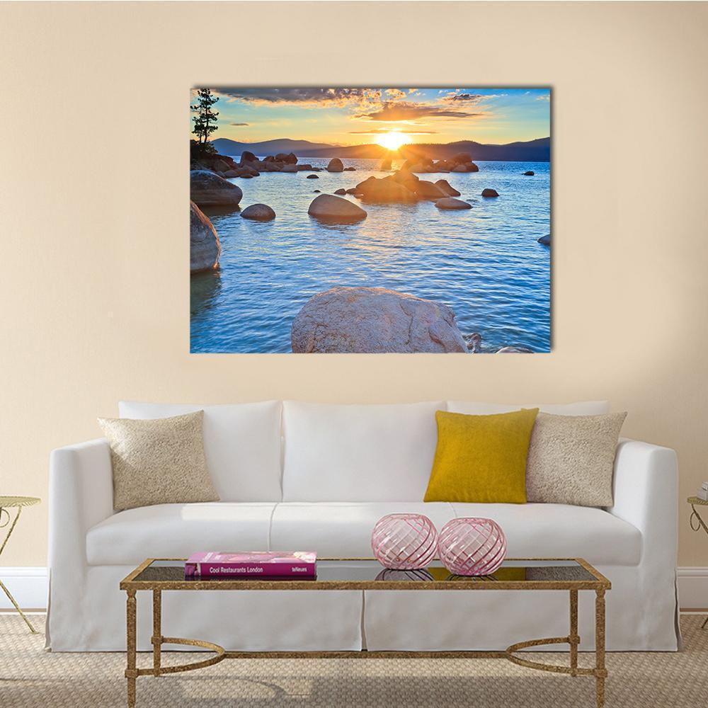 Lake Tahoe Sunset with Pine Silhouette Canvas Wall Art in orange, yellow and blue, single panel hung on a wall