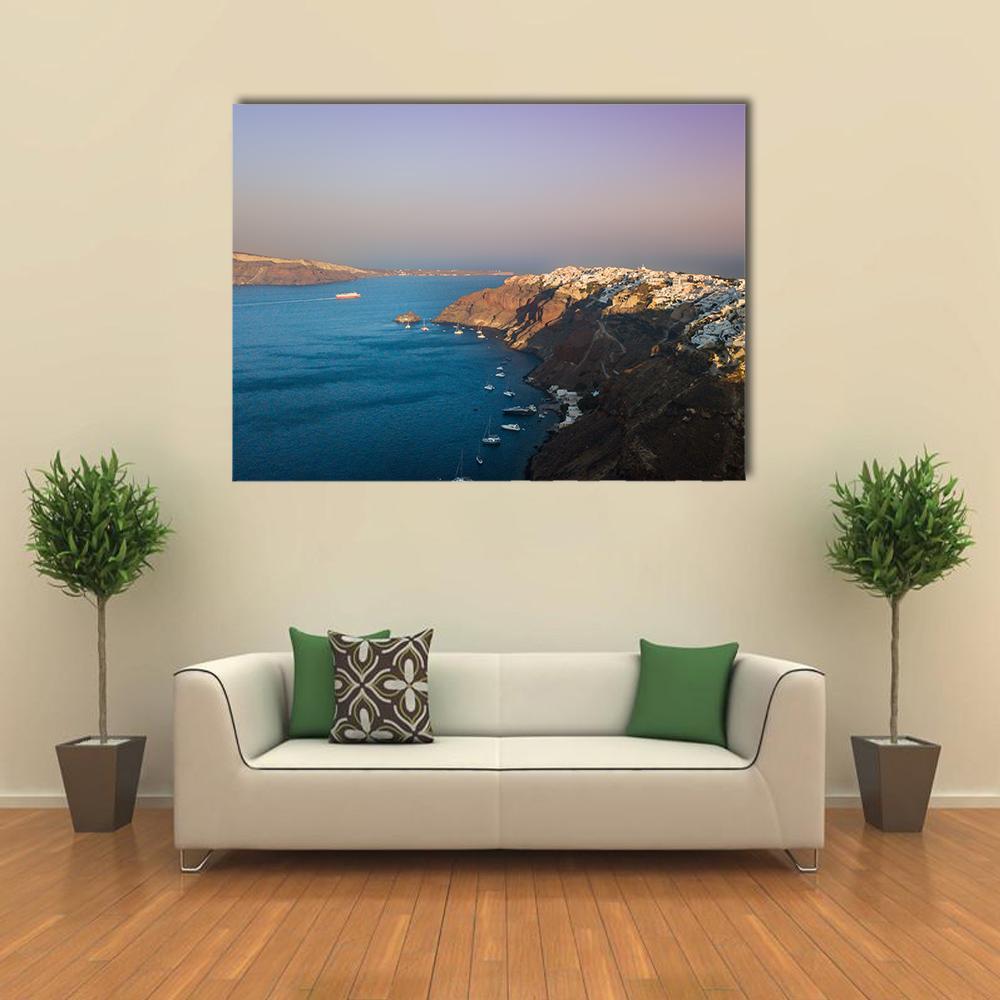 Oia Sunset, Santorini Canvas Wall Art in brown, blue and purple, single panel hung on a wall