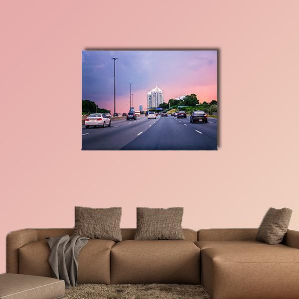 Sunset Highway in American City Canvas Wall Art in blue, purple and pink, single panel hung on a wall