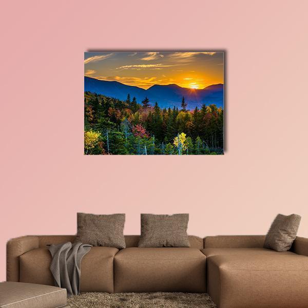 Autumn Sunset Over Mountain Pass Canvas Wall Art in orange, green and blue, single panel hung on a wall