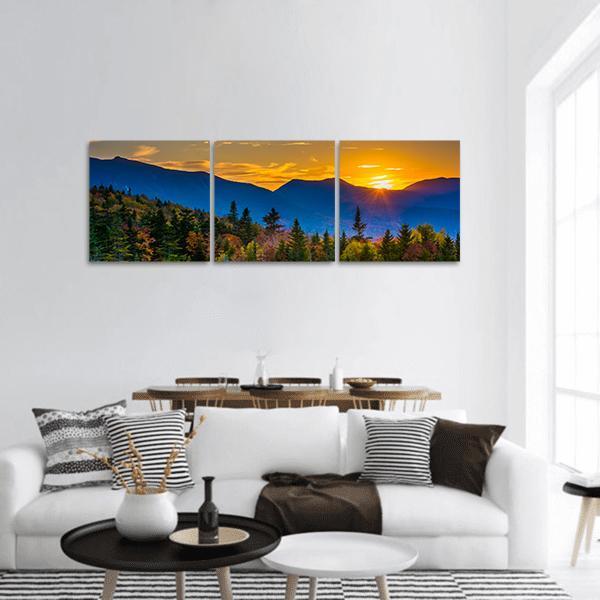 Kancamagus Pass Sunset Over Mountain Ridge Panoramic Canvas Wall Art in orange, yellow and blue, hung on a wall
