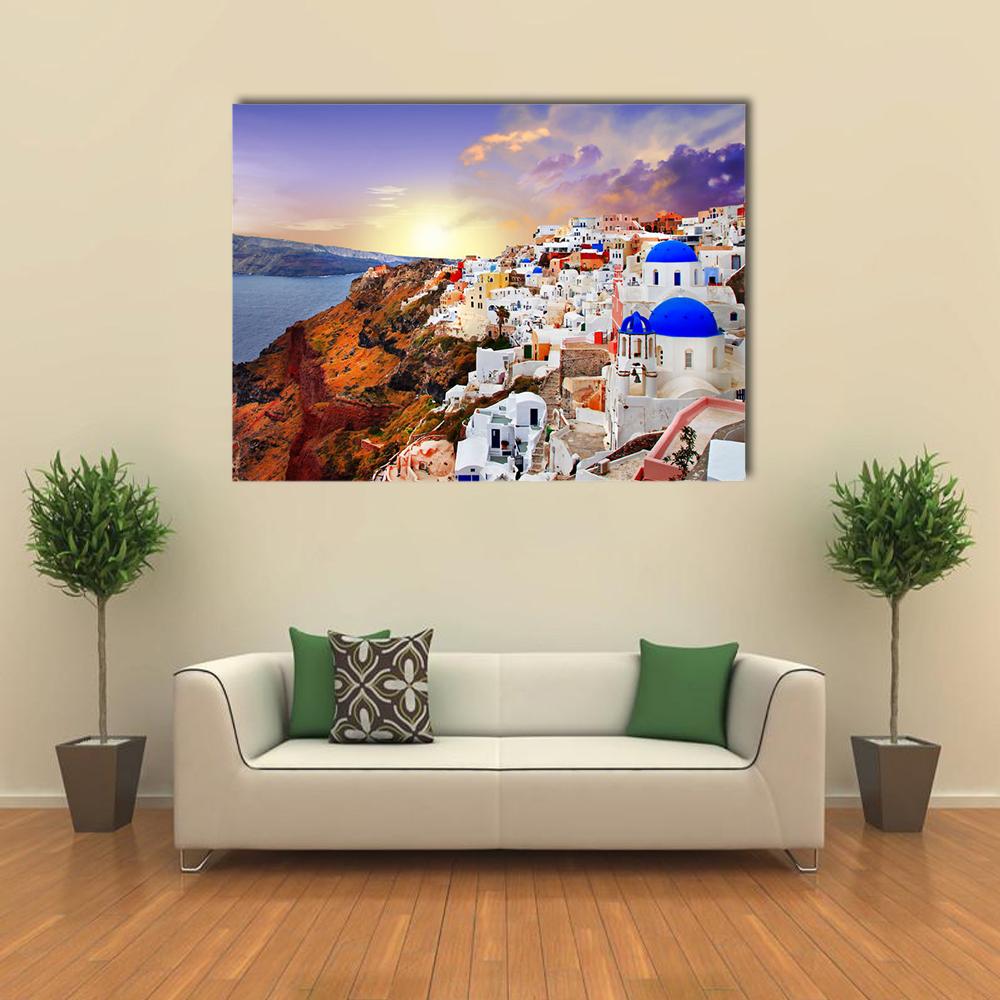 Sunset Over Santorini Canvas Wall Art in white, orange and blue, single panel hung on a wall