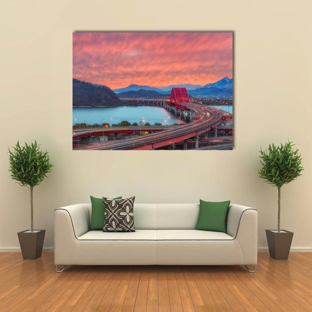 Banghwa Bridge Sunset with Light Trails Canvas Wall Art in orange, blue and pink, single panel hung on a wall