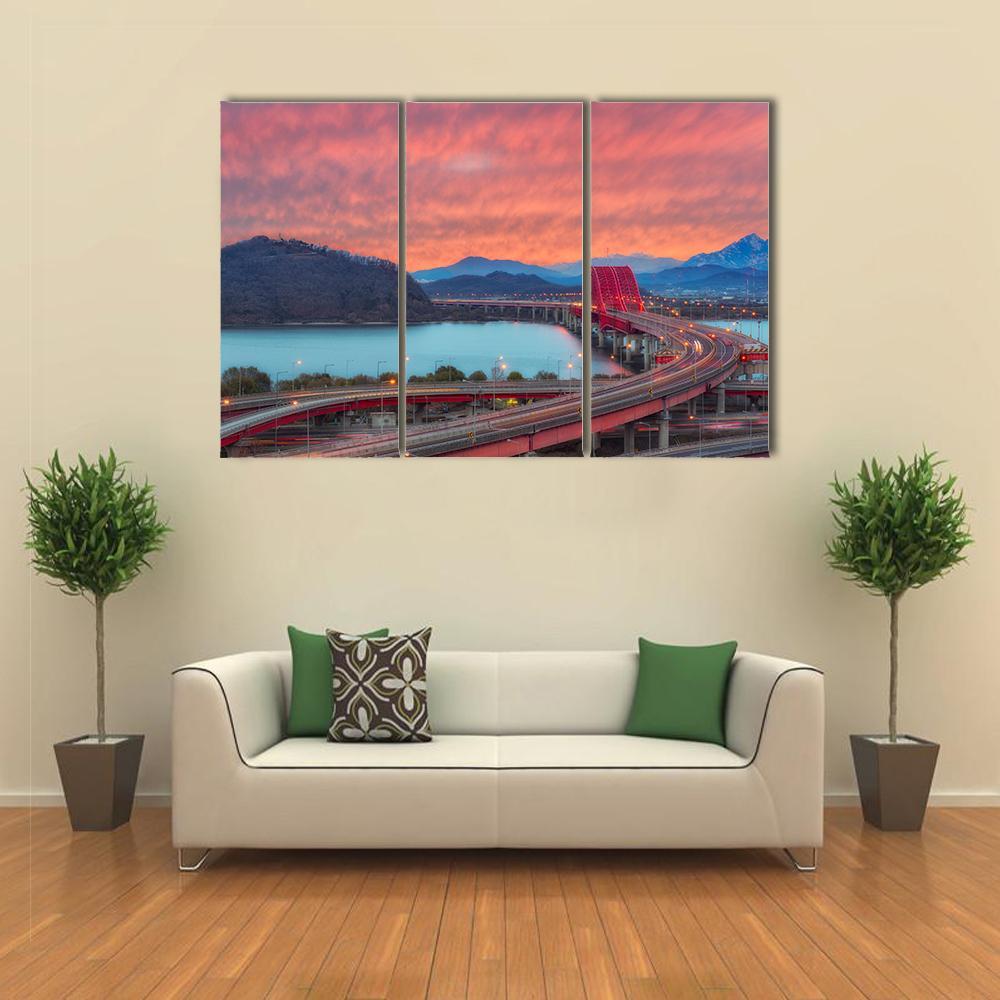 Banghwa Bridge at Sunset in Seoul Canvas Wall Art in red, blue and pink, 3 panel horizontal set hung on a wall