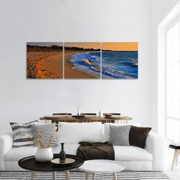 Sunset on New Jersey Beach Panoramic Canvas Wall Art in brown, orange and blue, hung on a wall
