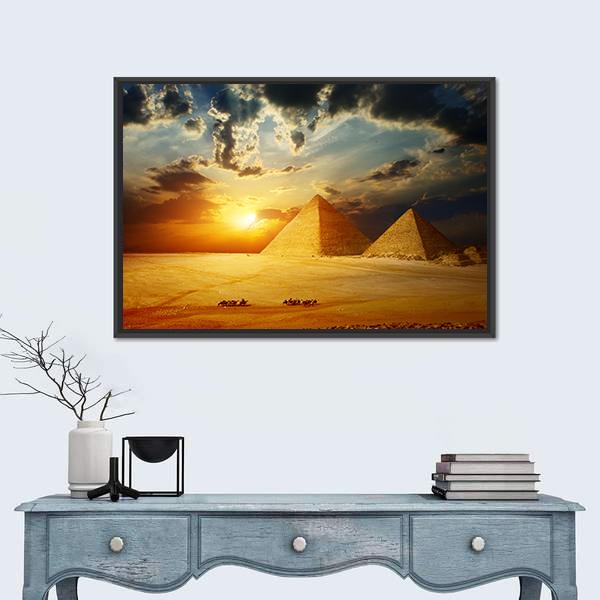 Sunset on Egyptian Pyramids Under Dark Clouds Canvas Wall Art in black, orange and yellow, framed canvas, product view on a white background