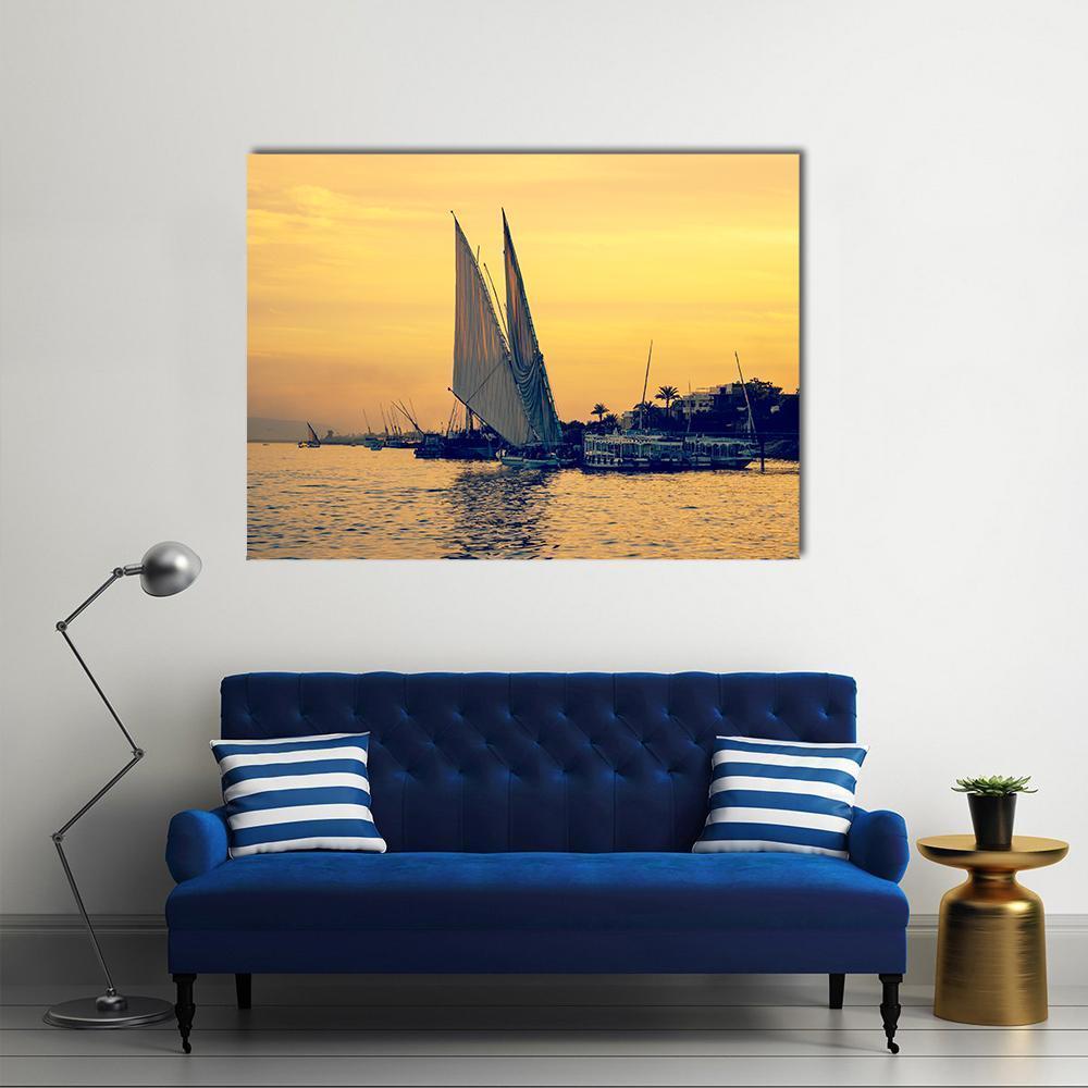 Sunset on the Nile Canvas Wall Art in orange, yellow and blue, single panel hung on a wall