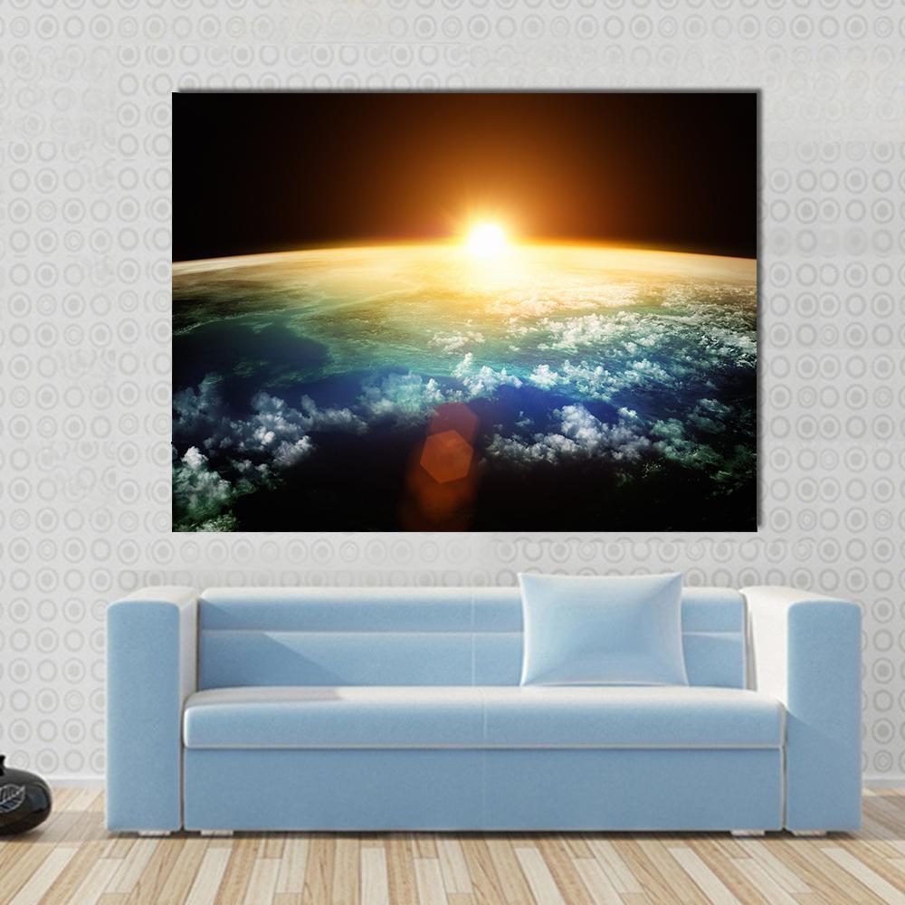 Sunset on Planet Earth Canvas Wall Art in black, orange and blue, single panel hung on a wall