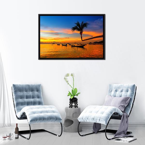 Sunset Beach with Leaning Palm and Boats Canvas Wall Art in orange, yellow and blue, framed canvas, product view on a white background