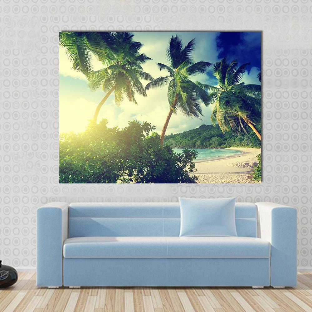 Sunset on the Beach Takamaka Mahe Island Canvas Wall Art in yellow, green and blue, single panel hung on a wall