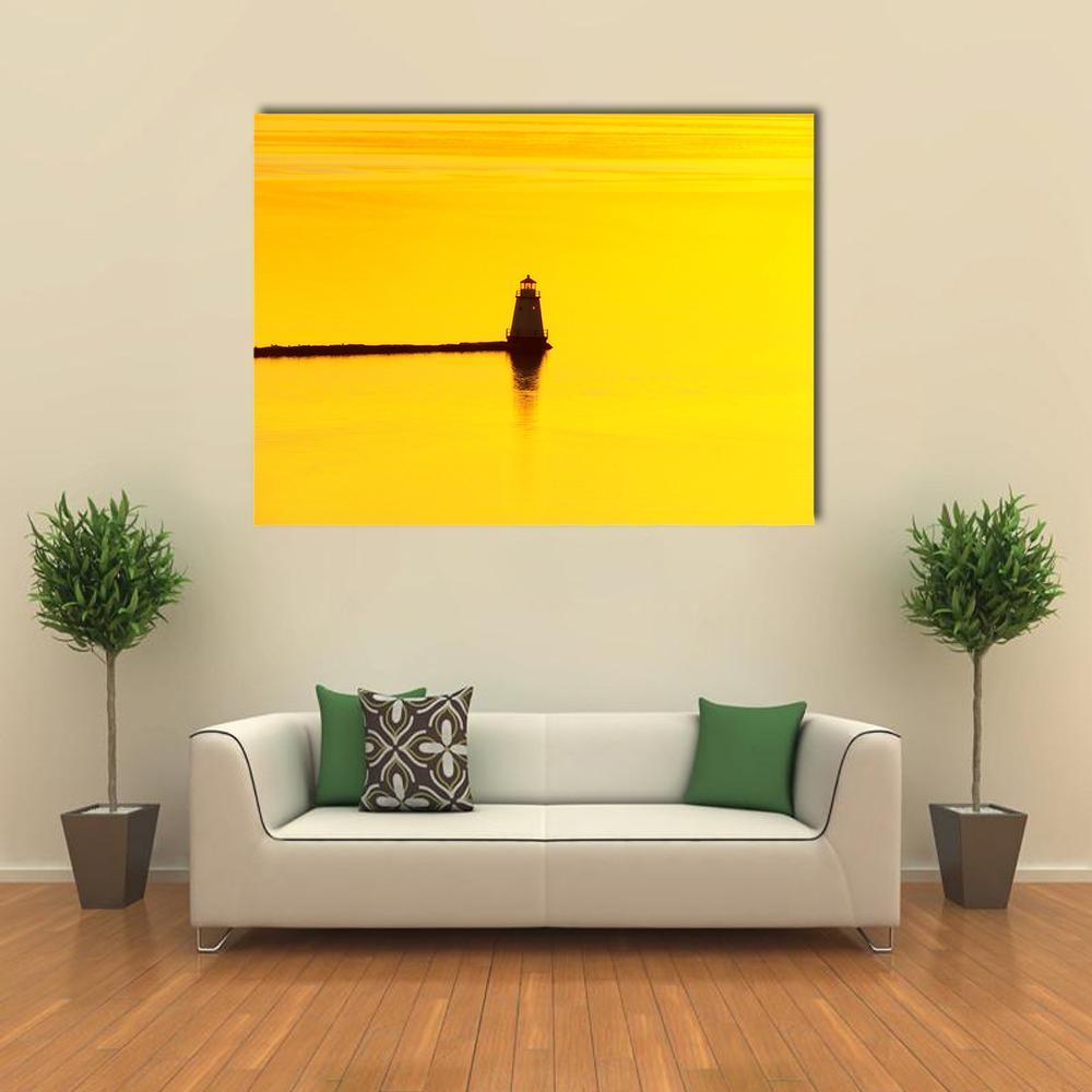 Lighthouse Sunset Over Lake Champlain Canvas Wall Art in black, orange and yellow, single panel hung on a wall