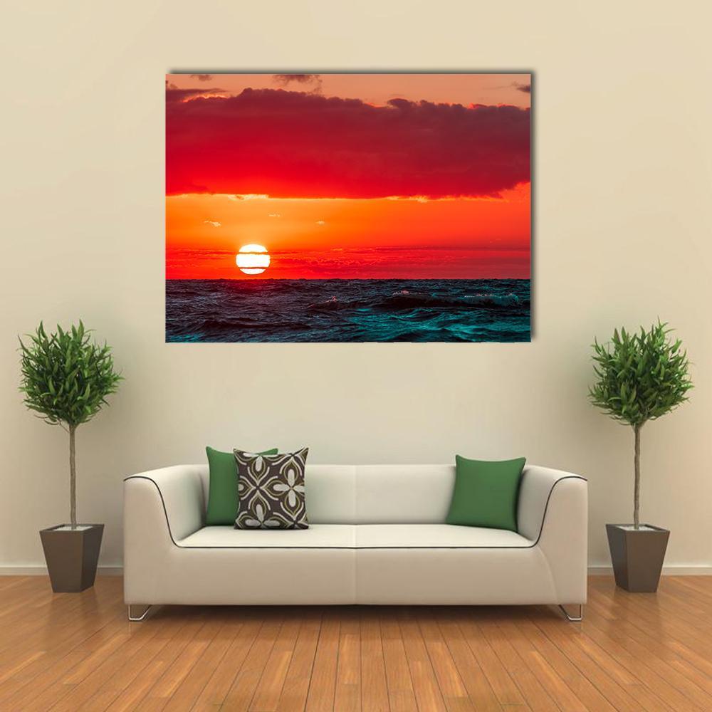 Sunset Over Baltic Sea Canvas Wall Art in red, orange and blue, single panel hung on a wall