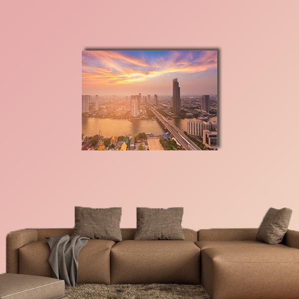 Sunset Over Bangkok Skyline Canvas Wall Art in orange, blue and purple, single panel hung on a wall