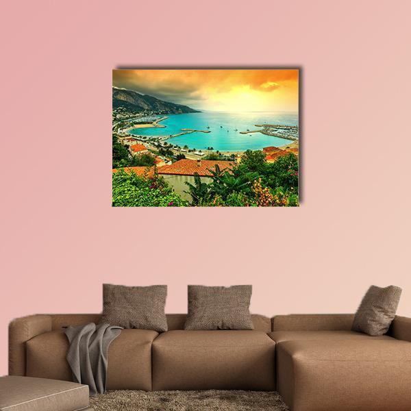Sunset Over Azur Coast Canvas Wall Art in orange, yellow and blue, single panel hung on a wall