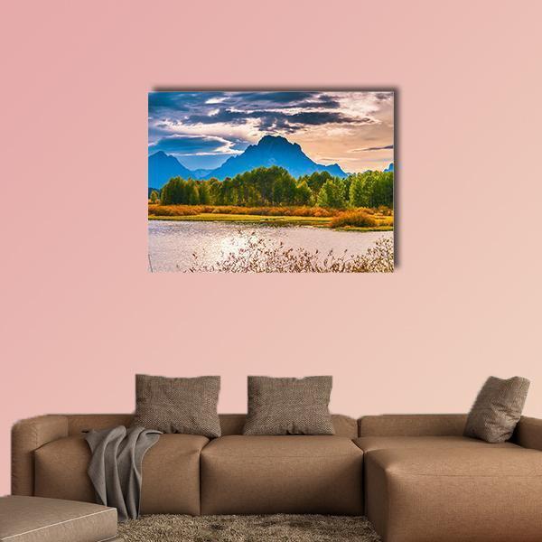 Sunset Over Mountain Lake Canvas Wall Art in orange, yellow and blue, single panel hung on a wall