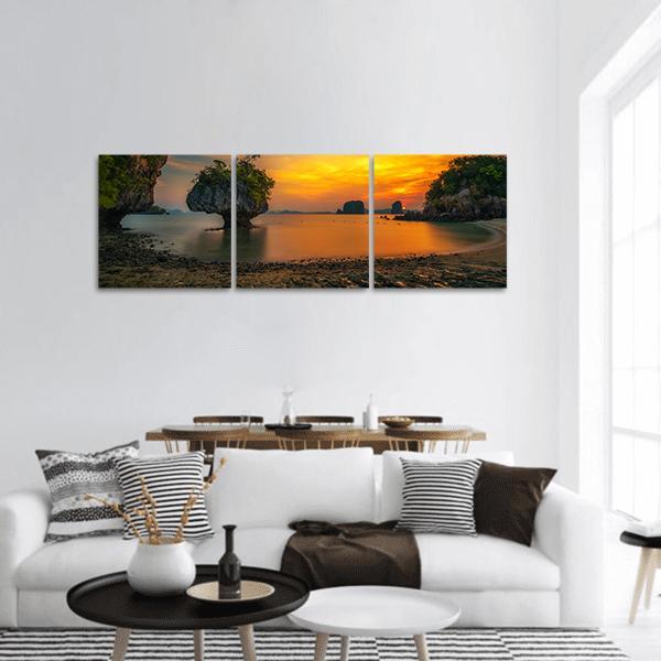 Sunset Over Ko Hong Island, Thailand Panoramic Canvas Wall Art in brown, orange and yellow, hung on a wall