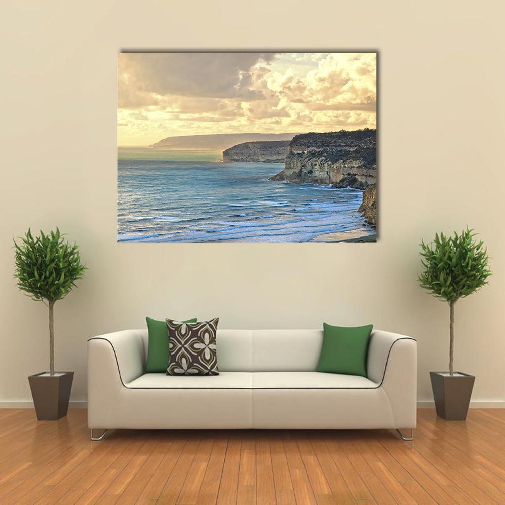 Sunset Over Kourion Coast, Cyprus Canvas Wall Art in beige, yellow and blue, single panel hung on a wall