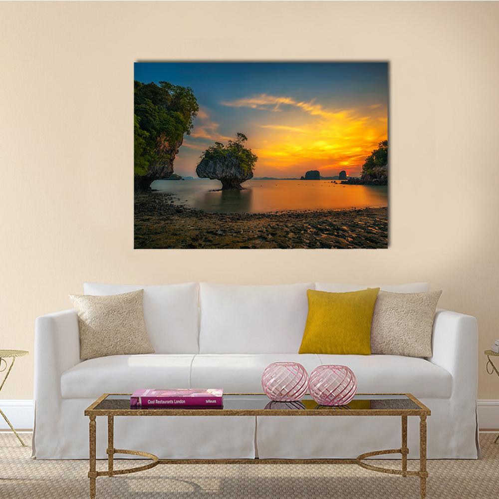 Mushroom Rock at Sunset Canvas Wall Art in orange, yellow and blue, single panel hung on a wall