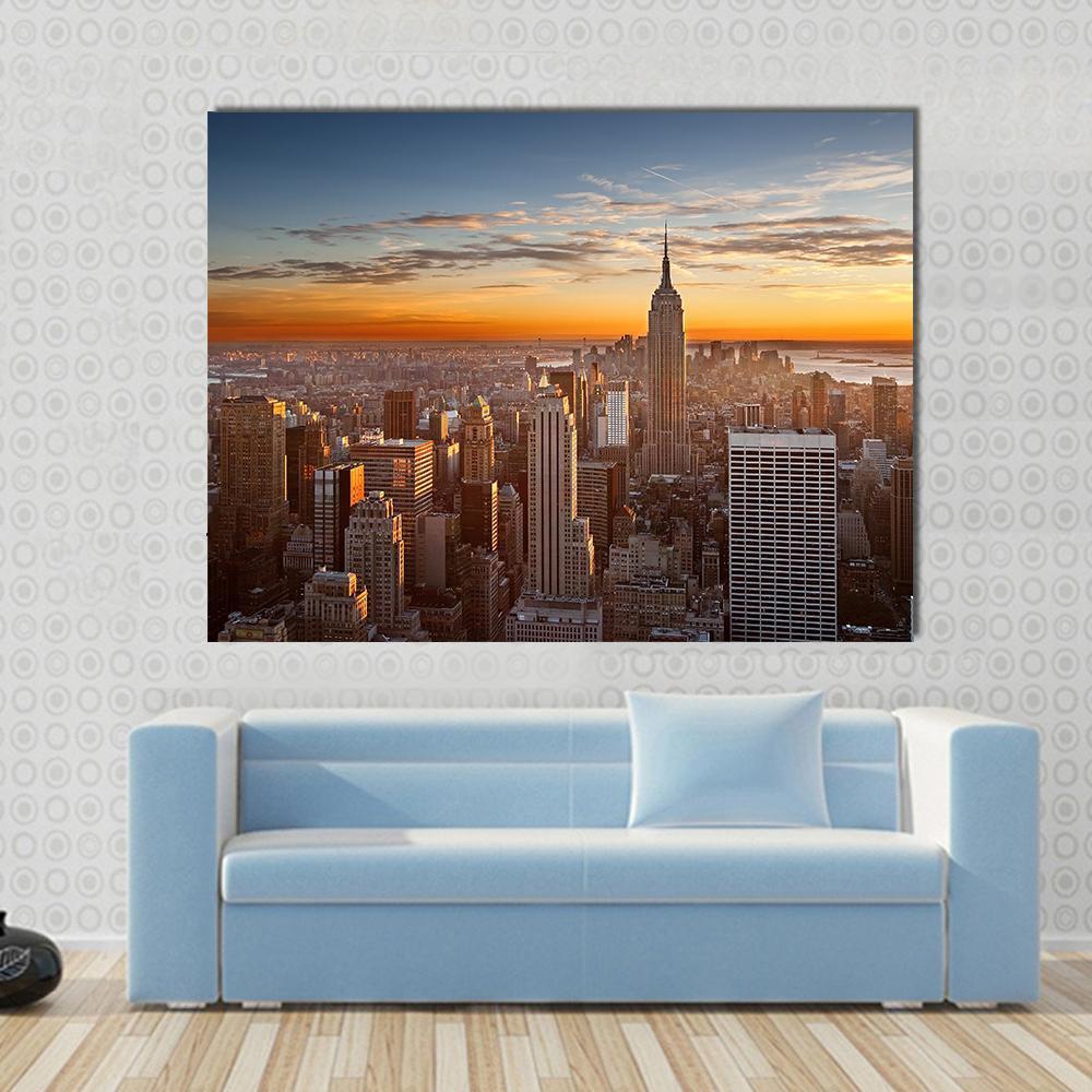 Sunset Over Manhattan Canvas Wall Art in brown, orange and blue, single panel hung on a wall
