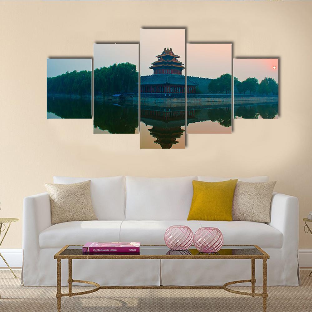Sunset Over the Forbidden City Canvas Wall Art in orange, green and blue, 5 panel Star layout hung on a wall