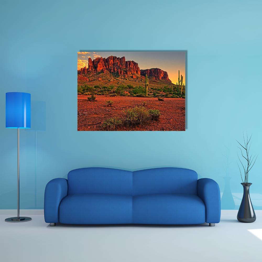 Sunset Over Desert Mountains Canvas Wall Art in brown, red and orange, single panel hung on a wall
