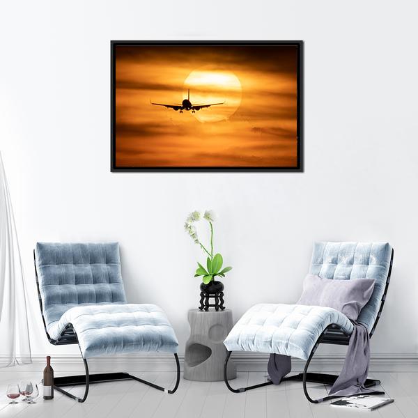 Airplane Silhouette at Sunset Canvas Wall Art in black, orange and yellow, framed canvas, product view on a white background
