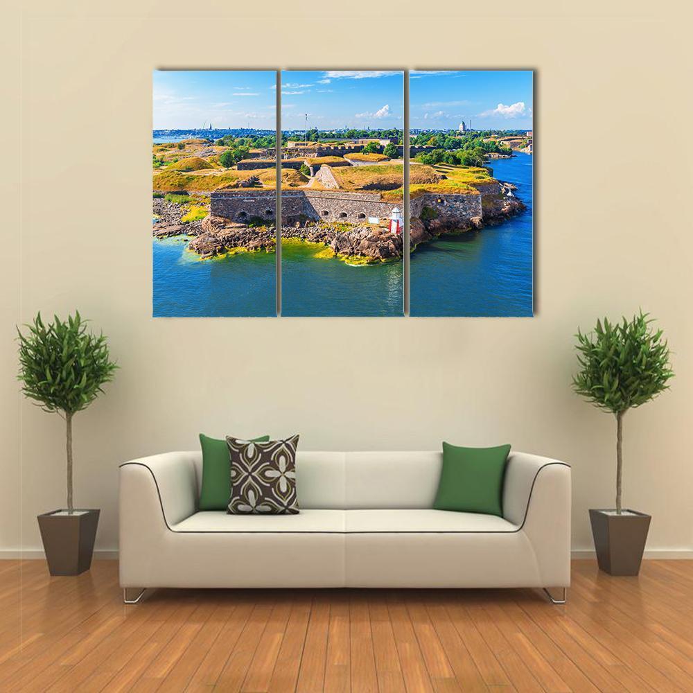 Suomenlinna Sea Fortress, Helsinki Canvas Wall Art in yellow, green and blue, 3 panel horizontal set hung on a wall