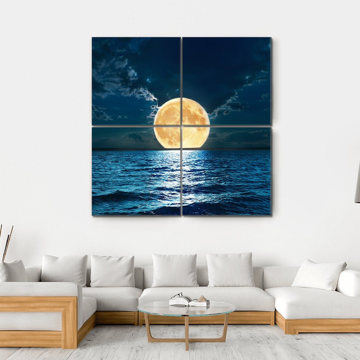 Supermoon Over Moonlit Sea Canvas Wall Art in yellow, blue and navy, hung on a wall