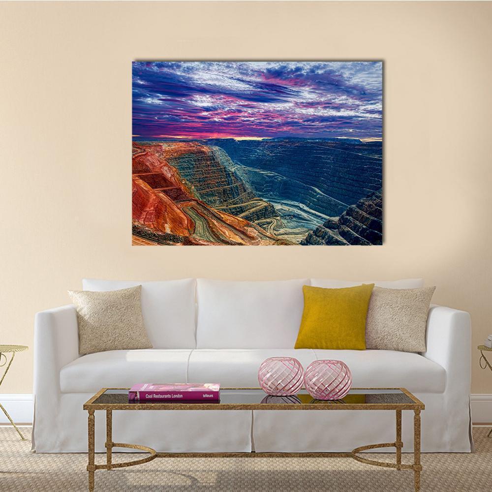 Sunset Over Terraced Mine Canvas Wall Art in orange, blue and purple, single panel hung on a wall