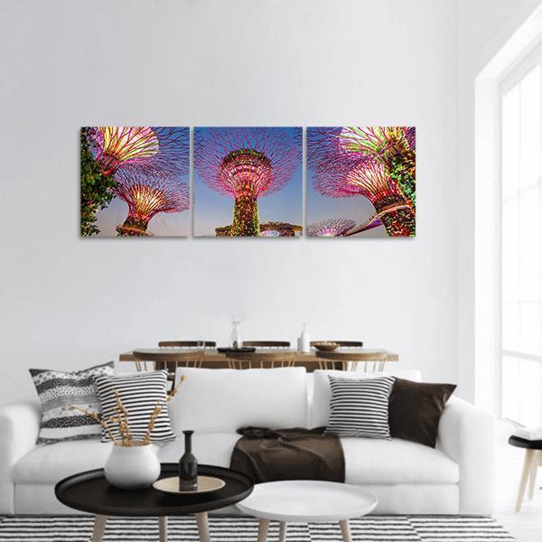 Supertree Grove at Gardens by the Bay Panoramic Canvas Wall Art in blue, purple and pink, hung on a wall