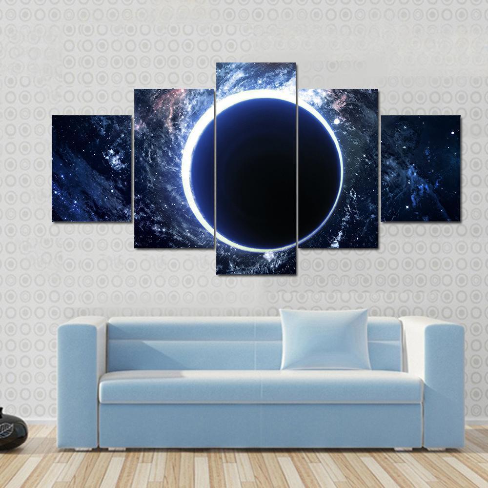 Supermassive Black Hole Canvas Wall Art in black, white and blue, 5 panel Star layout hung on a wall