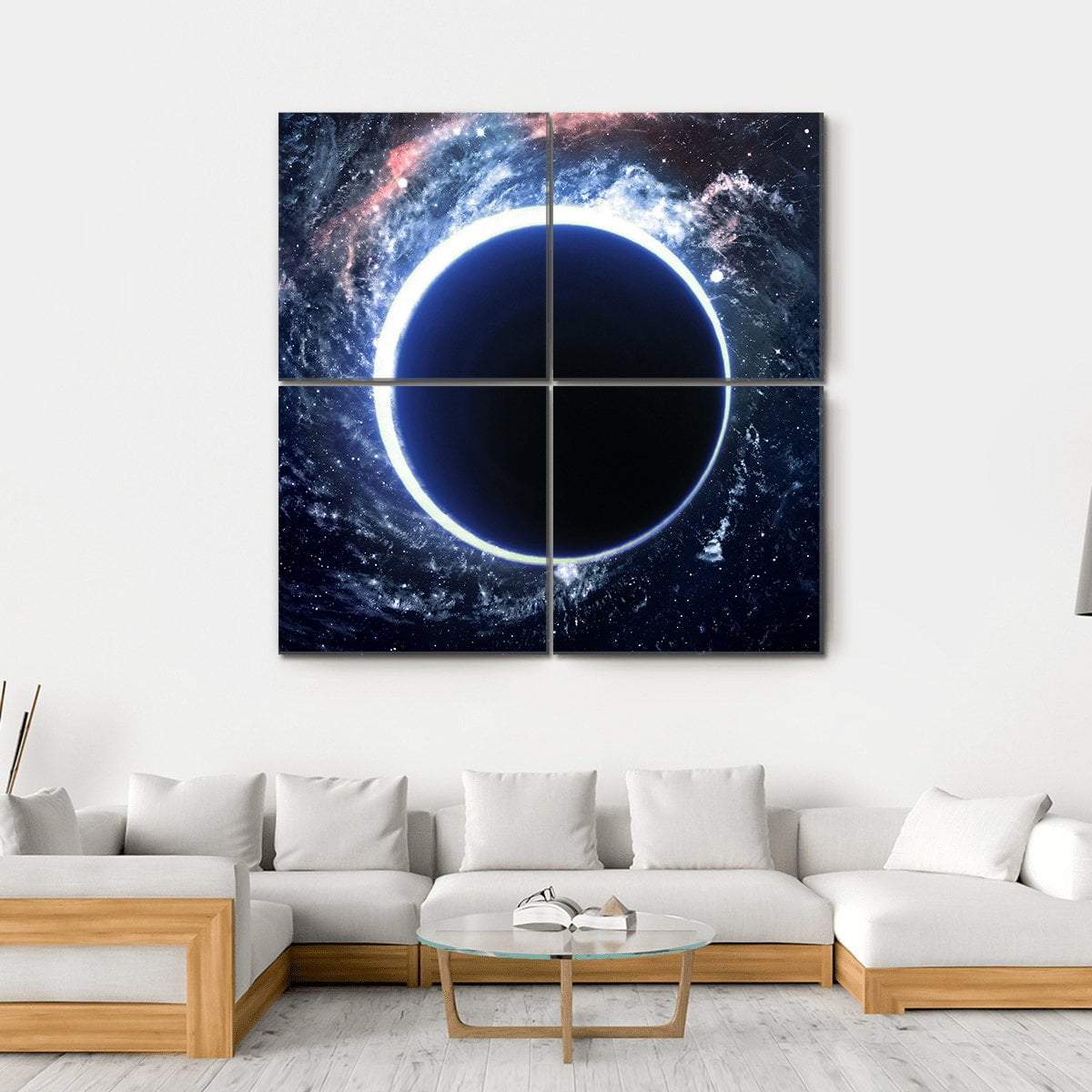 Supermassive Black Hole Canvas Wall Art in black, white and blue, hung on a wall