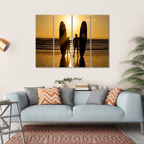 Surfer Couple Holding Long Surf Boards At Sunset On Beach Canvas Wall Art-4 Horizontal-Gallery Wrap-34" x 24"-Tiaracle