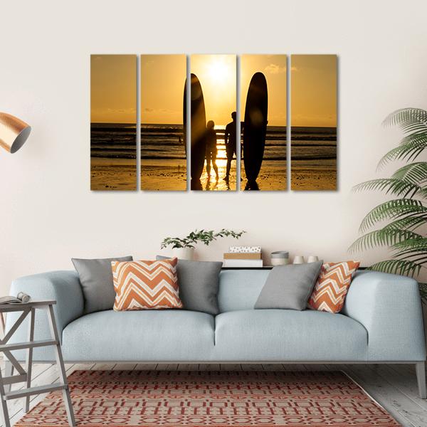 Surfer Couple Holding Long Surf Boards At Sunset On Beach Canvas Wall Art-5 Horizontal-Gallery Wrap-22" x 12"-Tiaracle