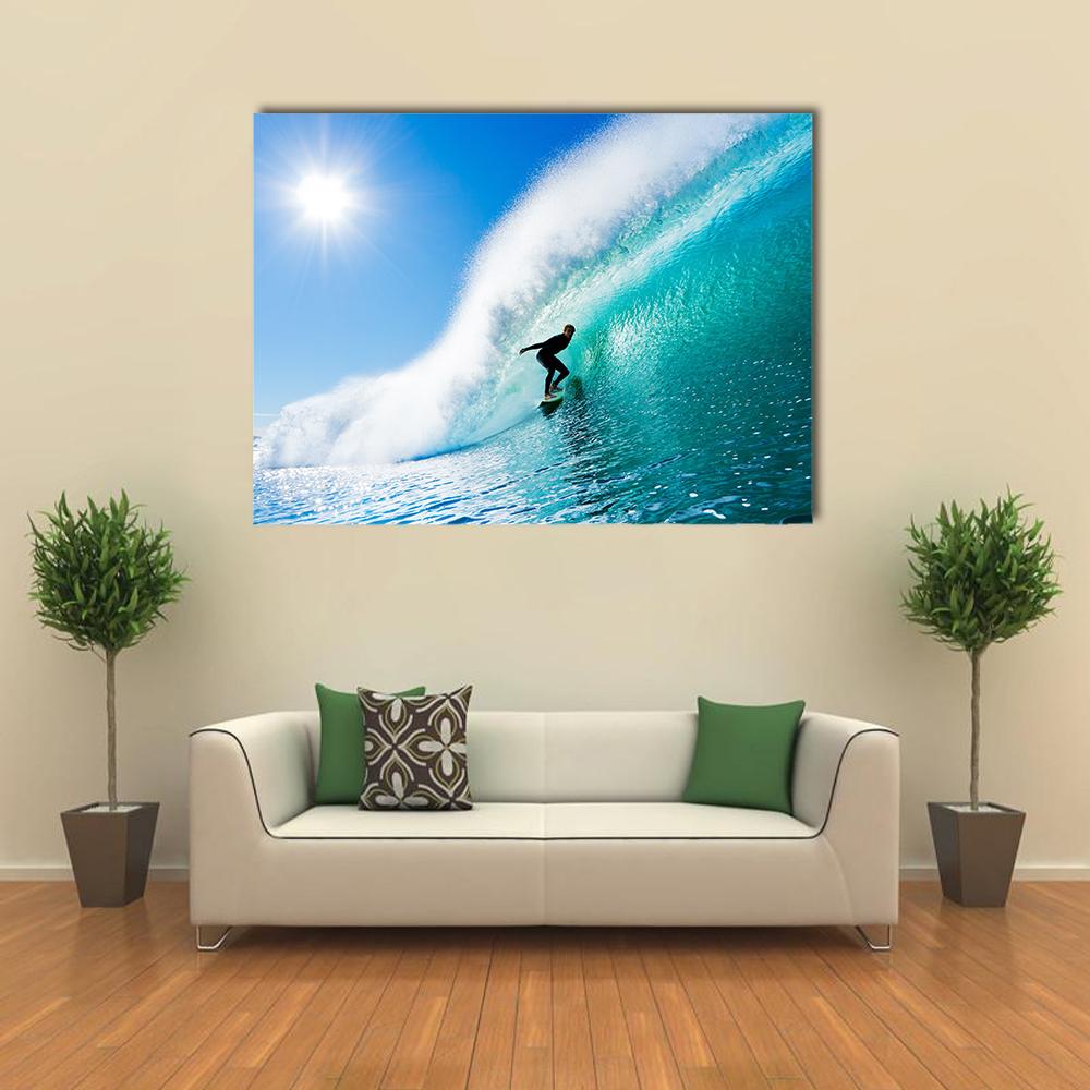 Surfer in Blue Barrel Wave Canvas Wall Art in white and blue, single panel hung on a wall