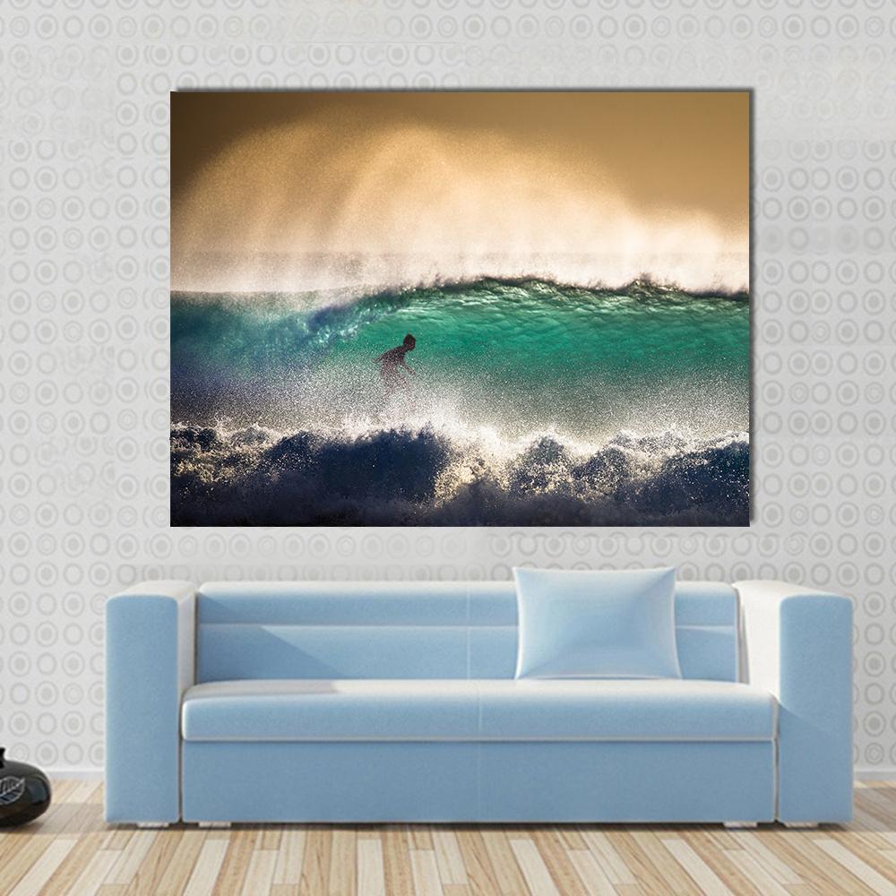 Bali Surfer in Turquoise Wave Canvas Wall Art in yellow, green and blue, single panel hung on a wall