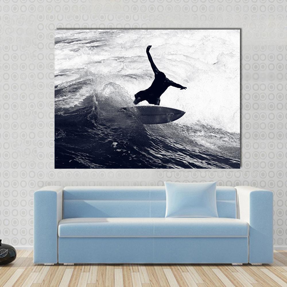 Surfer Riding the Waves Canvas Wall Art in black and white, single panel hung on a wall