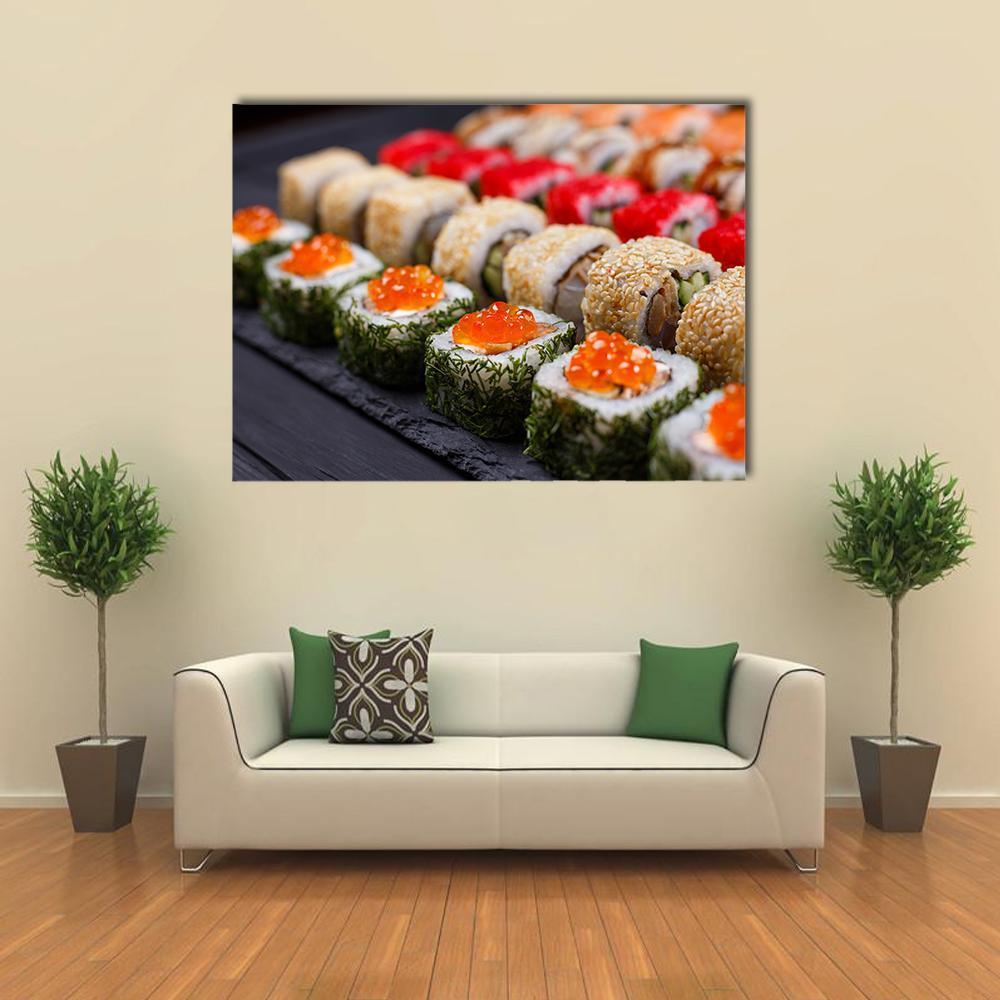 Sushi Rolls in Japanese Restaurant Canvas Wall Art in black, white and orange, single panel hung on a wall