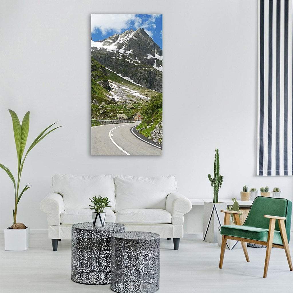 Susten Pass Road in Switzerland Vertical Canvas Wall Art in gray, green and blue, single vertical panel hung on a wall