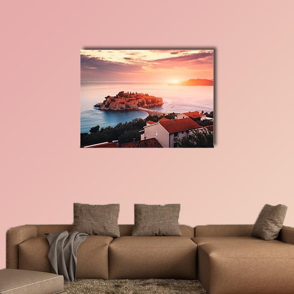 Sveti Stefan Island at Sunrise Canvas Wall Art in orange, blue and pink, single panel hung on a wall