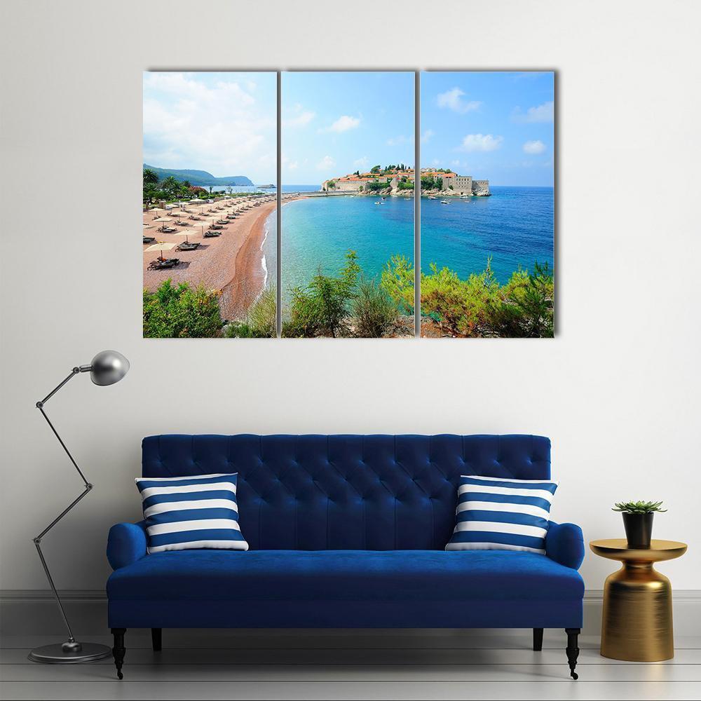 Sveti Stefan Island Village Canvas Wall Art in beige, green and blue, 3 panel horizontal set hung on a wall