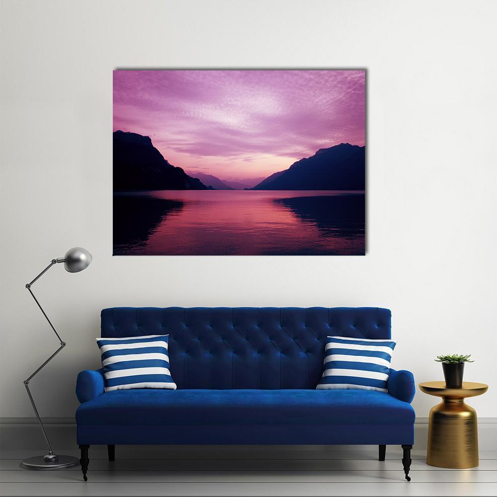 Lake and Mountains at Purple Dusk Canvas Wall Art in black, purple and pink, single panel hung on a wall