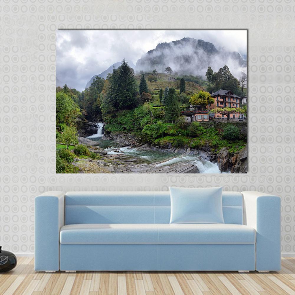 Swiss Mountain Village House and Waterfall Canvas Wall Art in white, gray and green, single panel hung on a wall